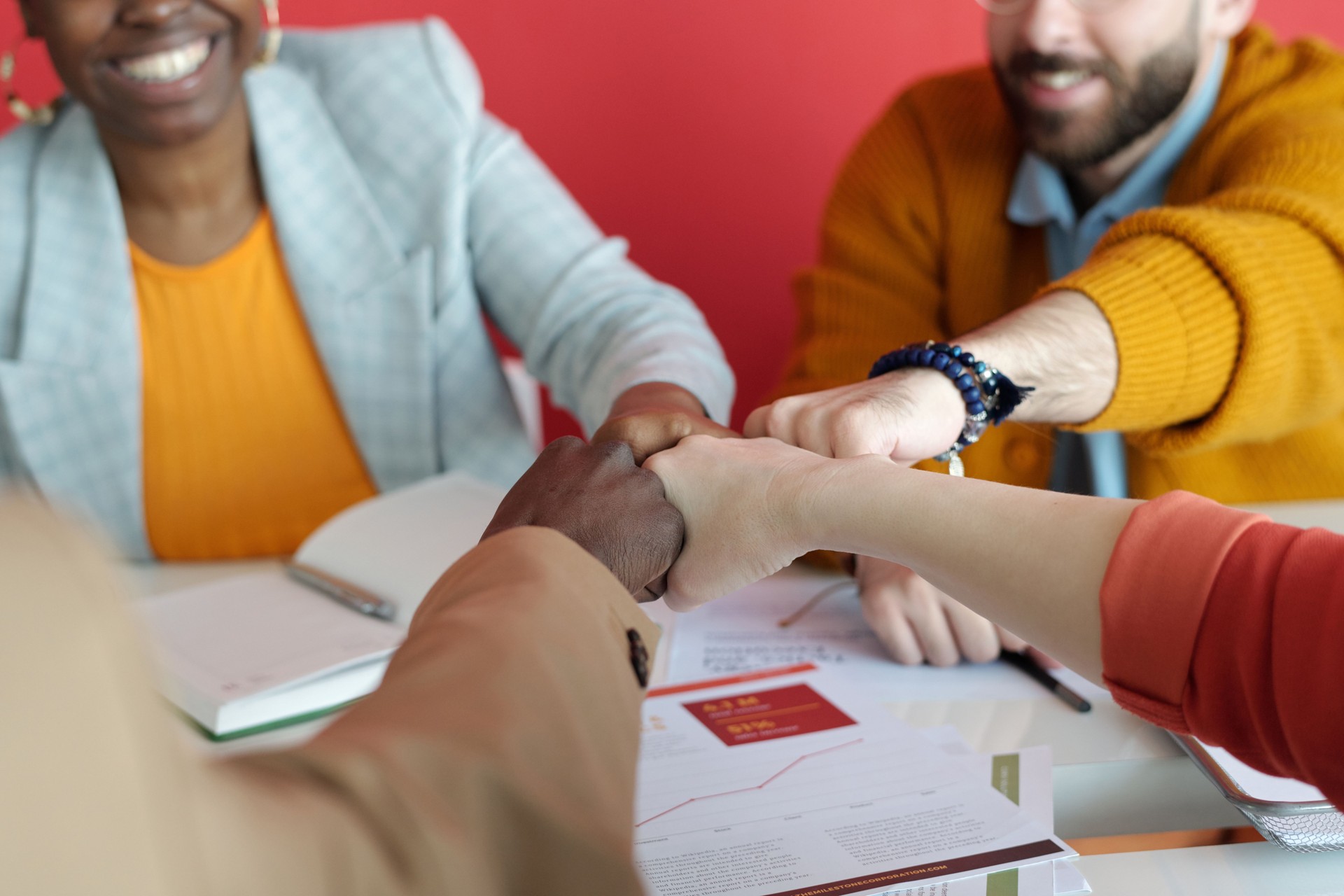 Multi-Ethnic Business Team Bumping Their Fists on Office Meeting